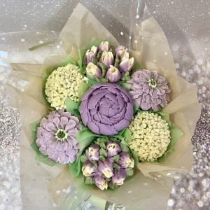 A beautiful bouquet of 7 piped flower cupcakes