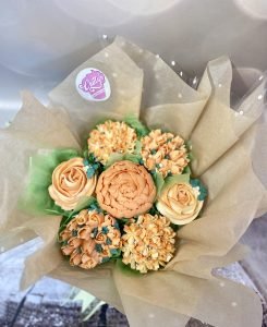 A beautiful bouquet of 7 piped flower cupcakes
