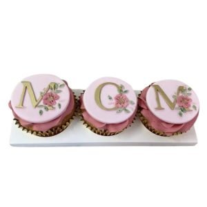 3 beautiful Chitty's Cakes cupcakes with plaques spelling MOM