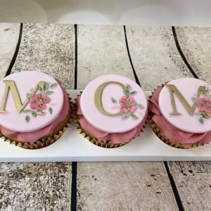 3 beautiful Chitty's Cakes cupcakes with plaques spelling MOM