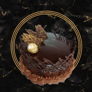 Delicious Chocolate Cake by The Bakers Shop, topped with chocolate shards and a Ferrero Rocher -available in Birmingham via Caketu.com